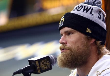 Feb 1, 2016; San Jose, CA, USA; Carolina Panthers tight end Greg Olsen is interviewed during Super Bowl 50 Opening Night media day at SAP Center. Mandatory Credit: Jerry Lai-USA TODAY Sports