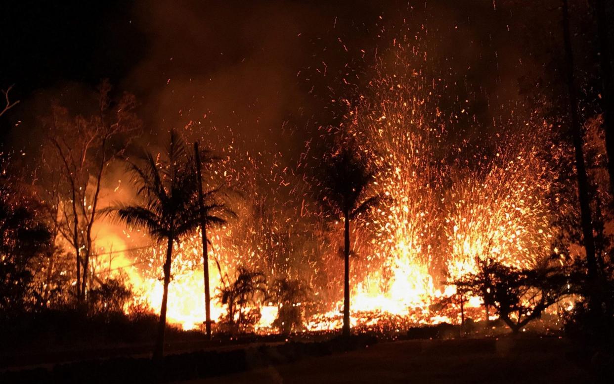 Lava fountains shoot 230 ft (70m) into the air in Leilani Estates, Hawaii - AFP