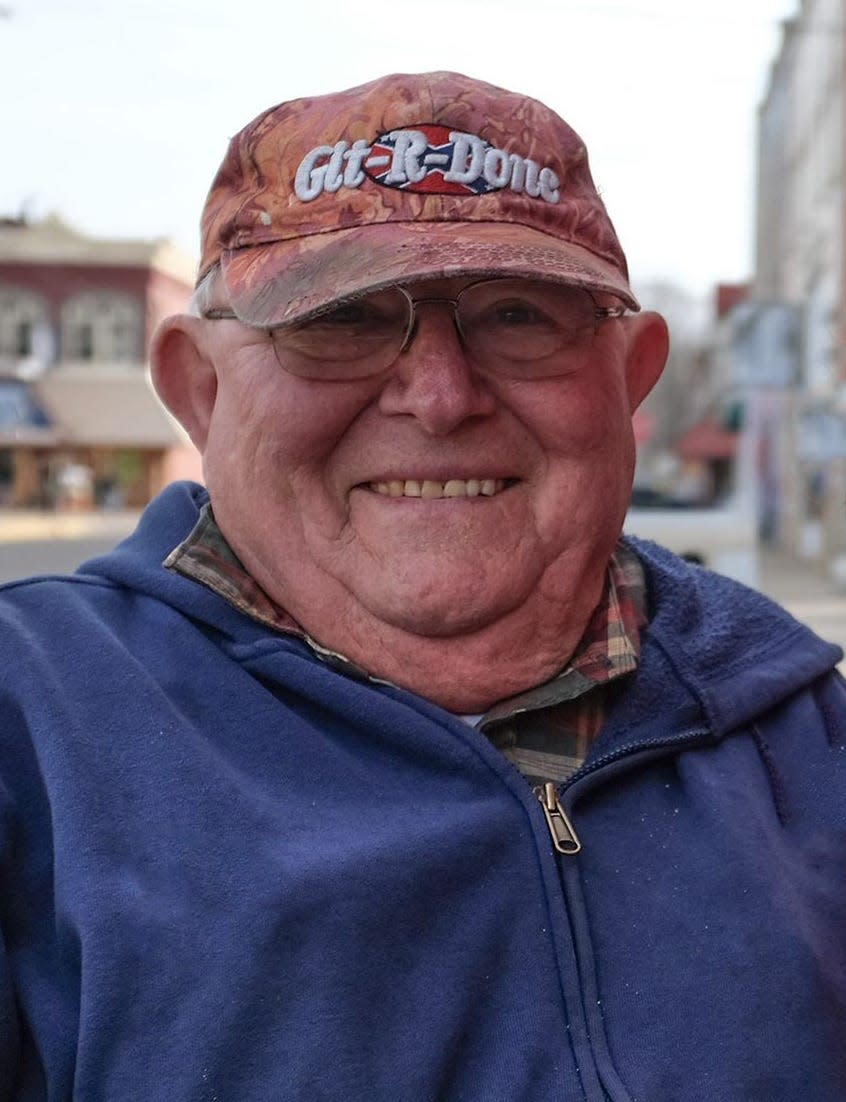 Roger Dershem smiles outside his restaurant while talking about when he opened Dershey's Cafe in St. Johns. He died from cancer on May 25, 2022.