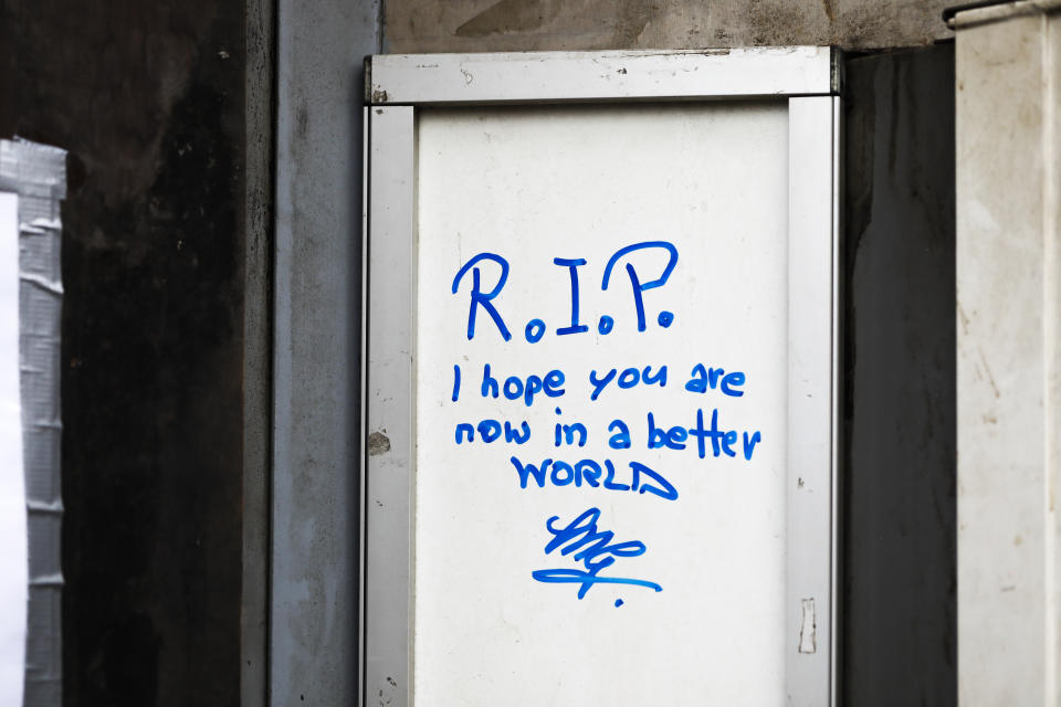 A message is seen at the entrance of the tobacco shop belonging to a woman who was covered on gasoline and lit on fire by her former partner Vienna, Austria, Friday, May 14, 2021. Austria is one of the few European Union countries where the number of women killed is higher than the number of men. The recent high-profile cases have led to widespread protests, demands for government intervention and condemnations from top politicians. (AP Photo/Lisa Leutner)