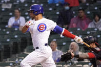 Chicago Cubs' Willson Contreras watches his two-run single off Washington Nationals starting pitcher Patrick Corbin during the third inning of a baseball game Tuesday, May 18, 2021, in Chicago. (AP Photo/Charles Rex Arbogast)