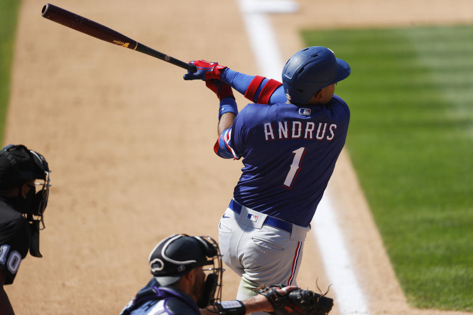 Texas Rangers' Elvis Andrus connects for a double off Colorado Rockies relief pitcher Daniel Bard in the eighth inning of a baseball game Sunday, Aug. 16, 2020, in Denver. (AP Photo/David Zalubowski)