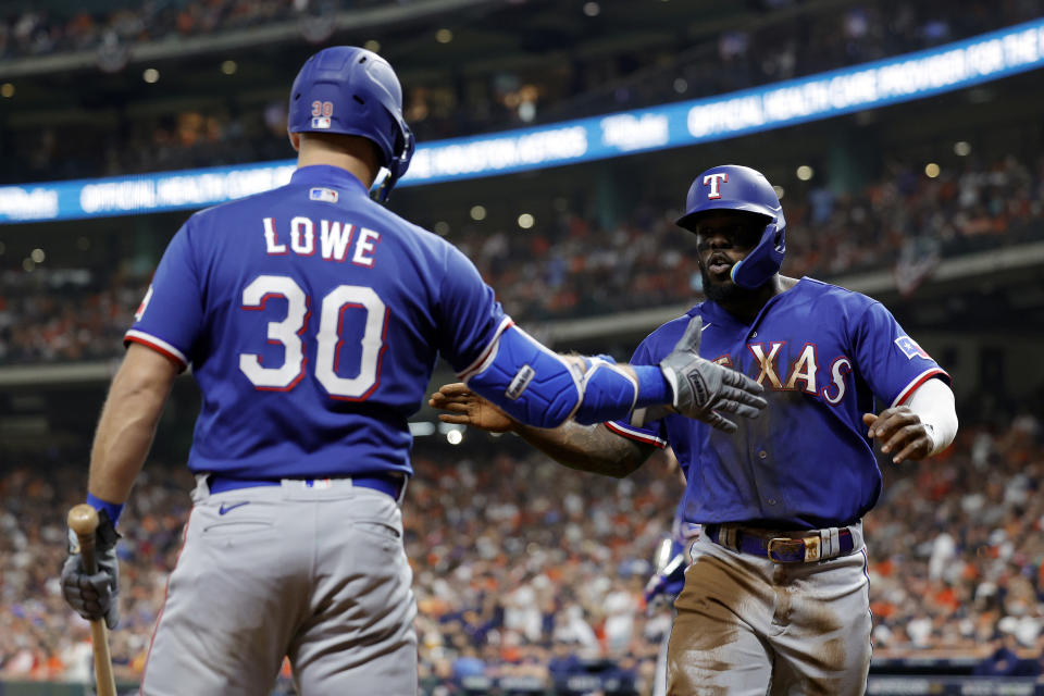 Adolis Garcia and Nathaniel Lowe are good with their bats and their gloves. (Carmen Mandato/Getty Images)