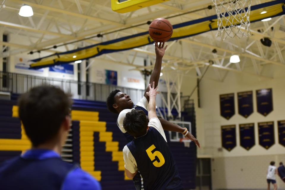 Port Huron Northern's Amir Morelan goes for a layup during a practice last month. He finished with seven points in the Huskies' 60-56 win over Croswell-Lexington on Saturday.