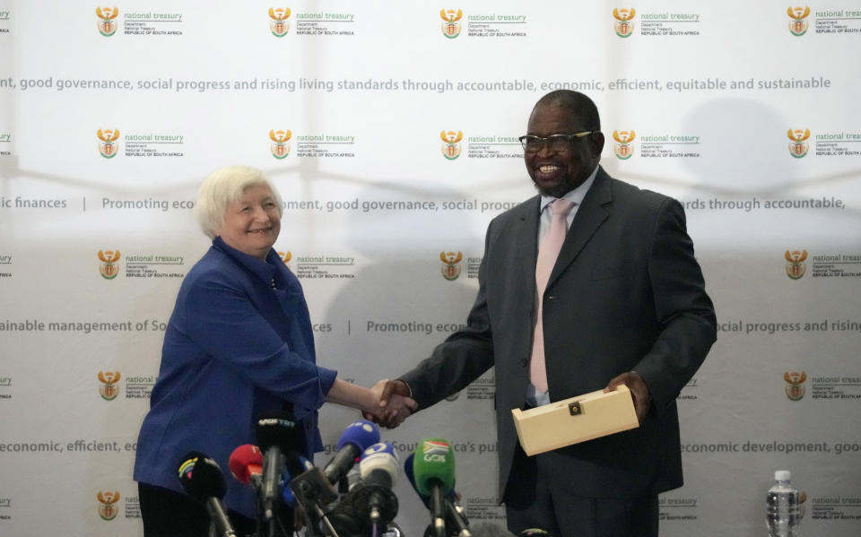 U.S. Treasury Secretary Janet Yellen, left, shakes hand with South Africa's Minister of Finance Enoch Godongwana during their meeting at the National Treasury in Pretoria, South Africa, Thursday, Jan. 26, 2023, part of her South Africa visit. Yellen is on a 10-day tour of Africa, part of a push by the Biden administration to engage more with the world's second-largest continent. (AP Photo/Themba Hadebe)