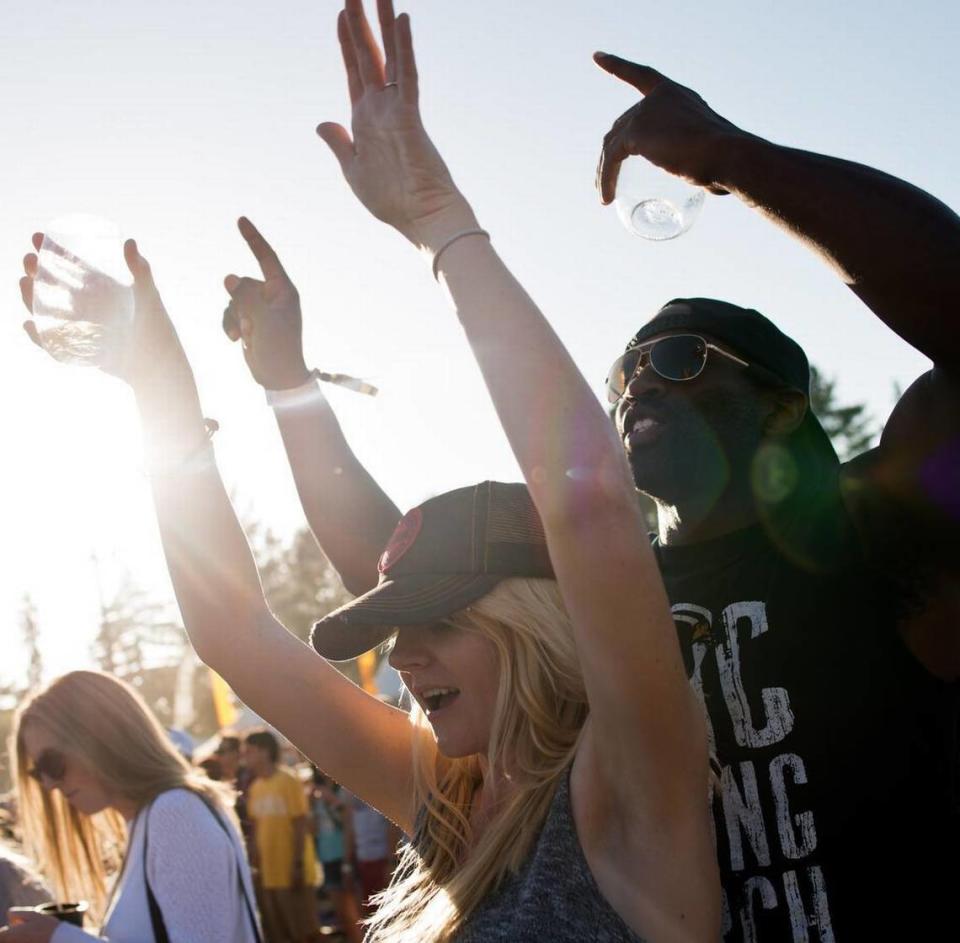 Jason Jackson and Jamie Arnott of San Francisco dance while rap star LL Cool J performs during the BottleRock music festival in Napa in 2014.