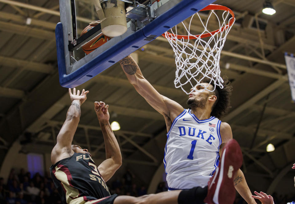 Duke's Dereck Lively II (1) blocks the shot of Florida State's Matthew Cleveland, left, during the first half of an NCAA college basketball game in Durham, N.C., Saturday, Dec. 31, 2022. (AP Photo/Ben McKeown)