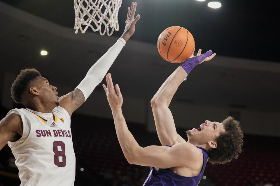 Arizona State forward Alonzo Gaffney (8) defends Washington center Braxton Meah (34) during the first half of an NCAA college basketball game Thursday, Feb. 22, 2024, in Tempe, Ariz. (AP Photo/Darryl Webb)