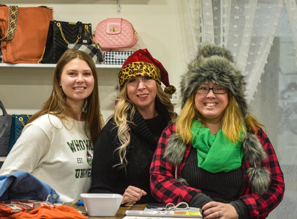 Kelly Rigoni, right, organized this year’s Port Clinton Sip and Shop, which drew shoppers from all over the state. With her at Gully’s Lake Wear are Kylie Gospodarek, left, and Valerie Hoeber, center.