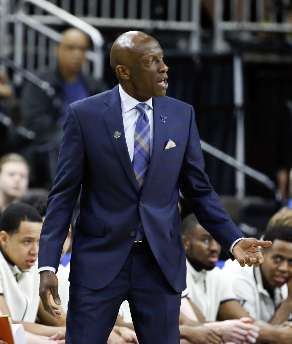 Yale head coach James Jones talks to players on the court during the first half of a first round men's college basketball game against LSU in the NCAA Tournament in Jacksonville, Fla., Thursday, March 21, 2019. (AP Photo/Stephen B. Morton)