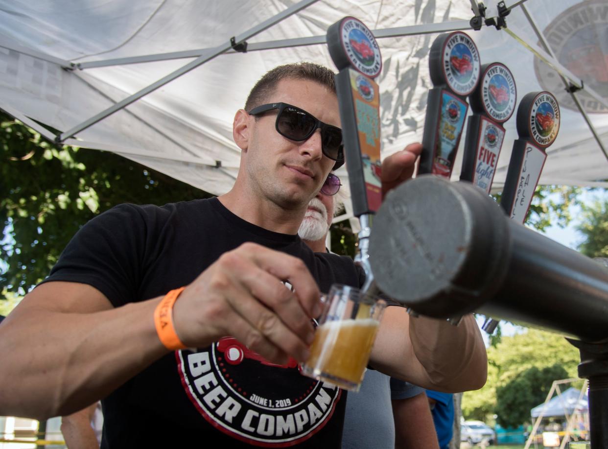 Charlie Lippert with the Lodi-based- Five Windows Beer Company pours a beer at the annual Stockton Brew Fest in east Stockton. The 6th Annual Stockton Brew Fest will be Saturday, Sept. 10.