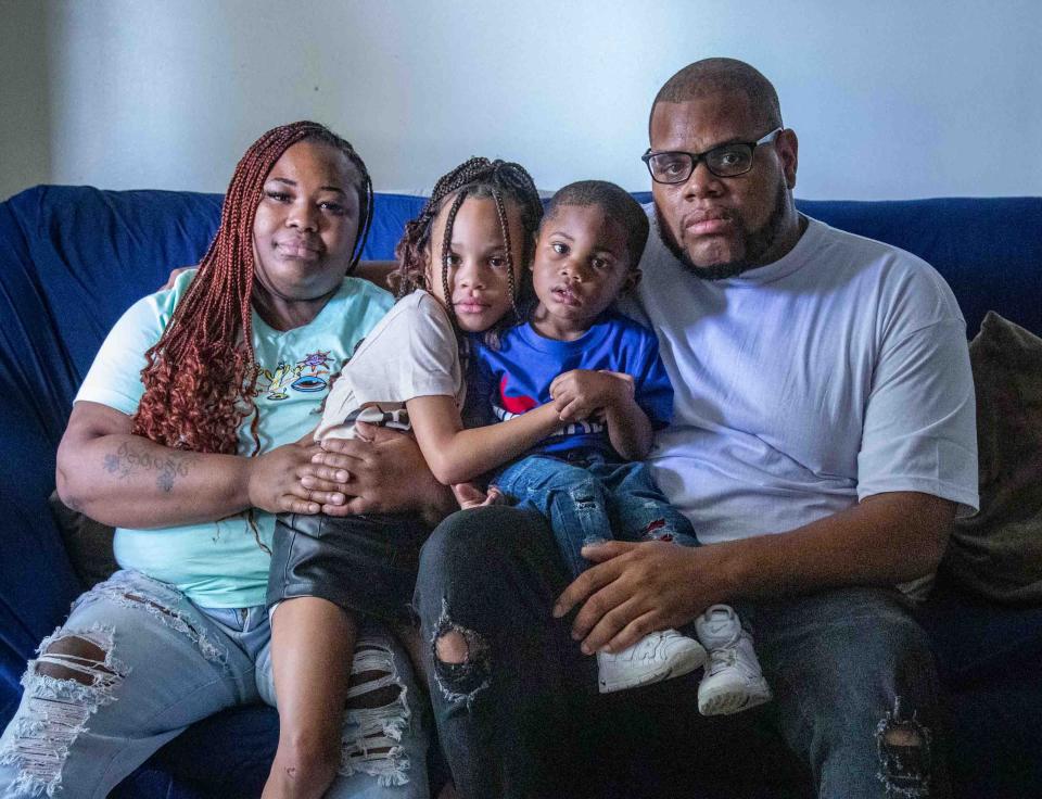 Tiffany Pinkney, far left, a Season to Share nominee who has been diagnosed with Huntington's disease, sits in her Lake Worth Beach apartment with her son Kendric, 2, daughter Saniyah, 6, and her partner and the father of her children, Marquis Lacy.
