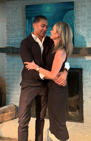 <p>Amy Robach/Instagram</p> Amy Robach and T.J. Holmes embrace one another