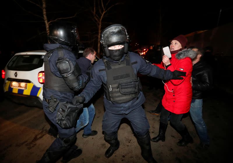 Demonstrators protest the arrival of evacuees from China in Poltava region