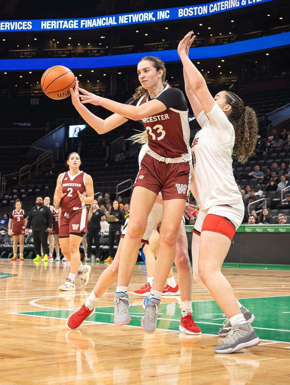 Worcester Academy's Ella Getz of Wayland passes the ball against the Rivers School at the TD Garden in Boston on Sunday.