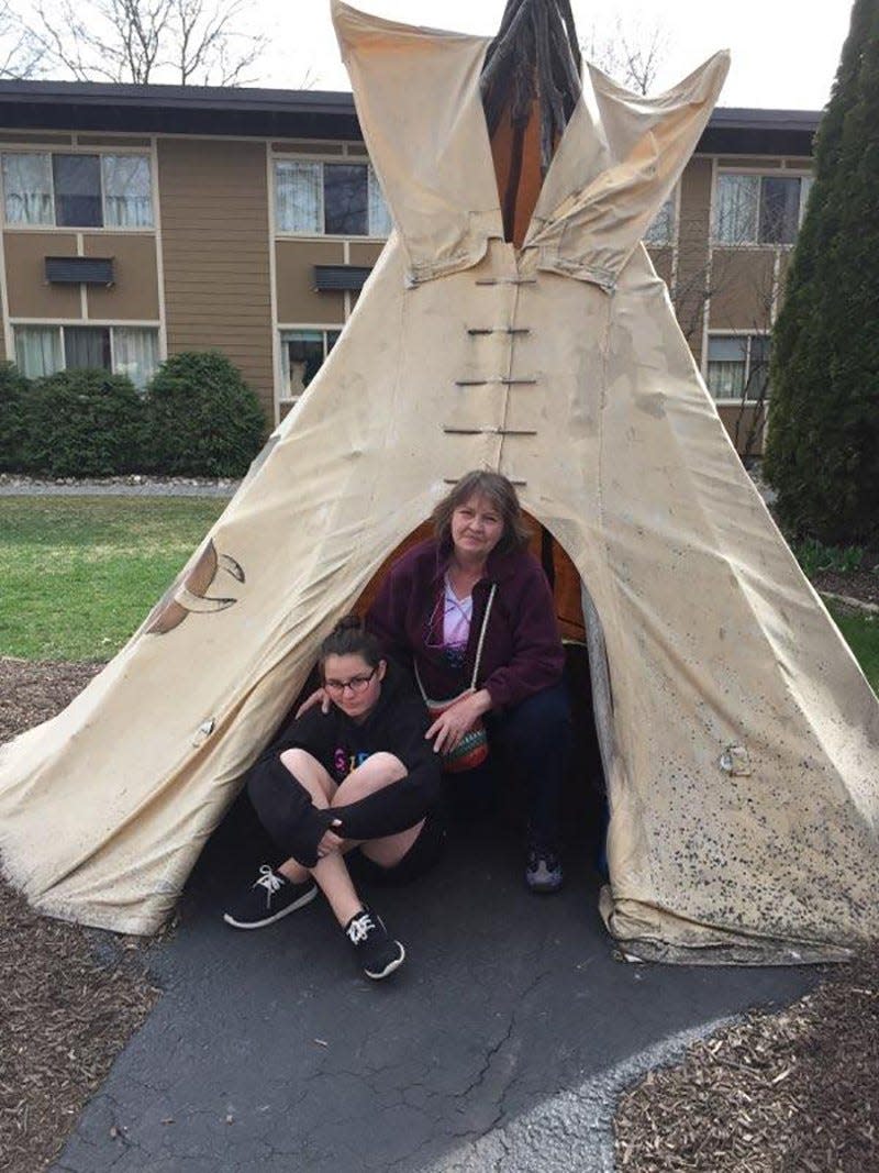 Michelle Elefson and her daughter, Abby, check out a teepee on Cape Cod. Their Girl Scout troop enjoyed a weekend trip there to learn about windmills and water power.