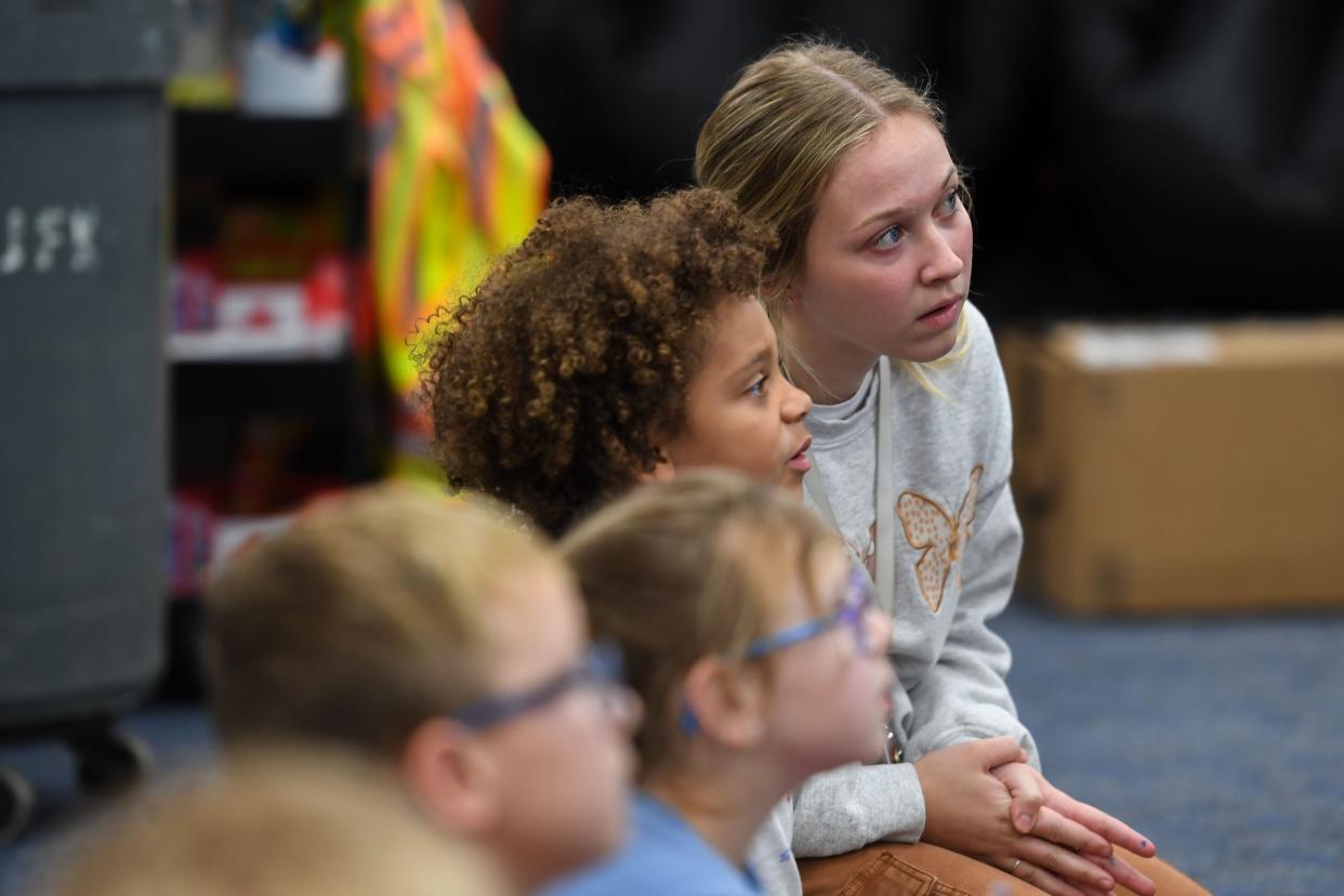 Kindergarten teacher Jeryn Mediger sits with her students during music class on Thursday, Oct. 5, 2023 at John F. Kennedy Elementary in Sioux Falls, South Dakota.