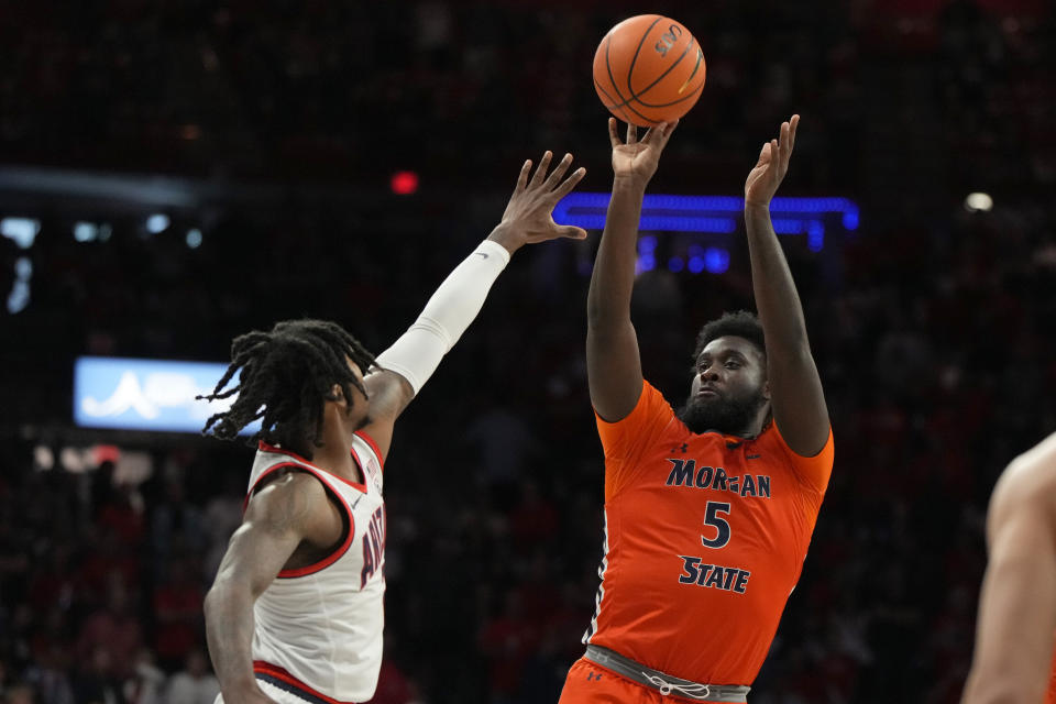 Morgan State forward Myles Thompson (5) shoots over Arizona guard Caleb Love, left, during the first half of an NCAA college basketball game Monday, Nov 6, 2023, in Tucson, Ariz. (AP Photo/Rick Scuteri)