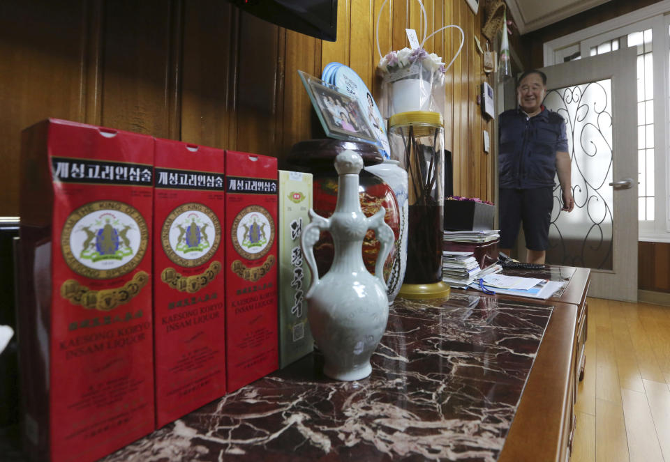 In this Aug. 23, 2018, photo, Ham Sung-chan, 93, watches gifts he received from his North Koran brother Ham Dong Chan during an interview at his house in Dongducheon, South Korea. After nearly 70 years of a separation forced by a devastating 1950-53 war that killed and injured millions and cemented the division of the Korean Peninsula into North and South, Ham, 93, and his North Korean brother only got a total of 12 hours together. (AP Photo/Ahn Young-joon)