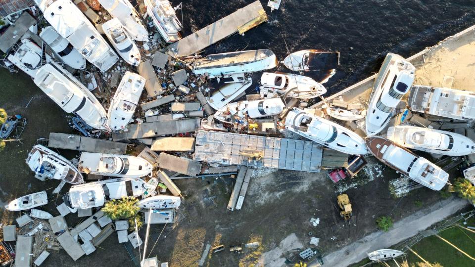 Aerial footage of damaged boats in Fort Myers after Hurricane Ian.