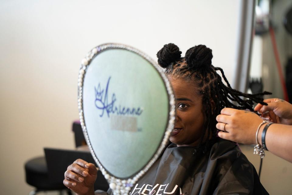 Kelly Livingston, an attorney at JPMorgan Chase, has her locs styled by Adrienne Wakefield at Cheveux Adorn Hair and Nail.