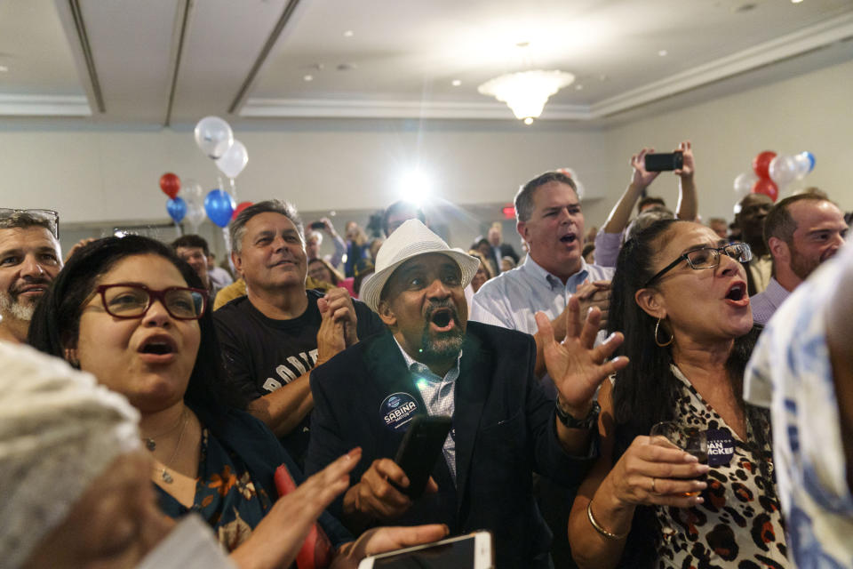 Supporters cheer as Rhode Island Gov. Dan McKee gives an acceptance speech at a primary election night watch party in Providence, R.I., Tuesday, Sept. 13, 2022. (AP Photo/David Goldman)