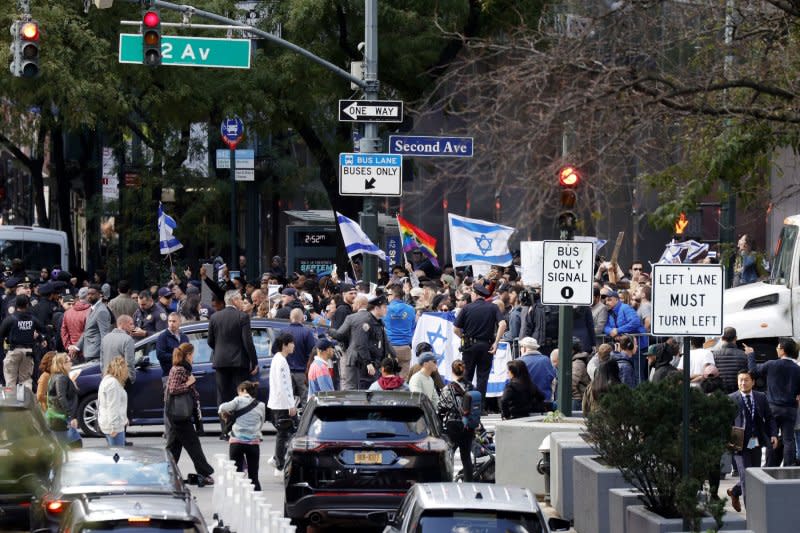 Israel supporters hold flags standing on Second Avenue at an Emergency Rally for Gaza event on Monday in New York City, more than 2 days after Hamas launched a surprise assault in Israel where more than 700 people were killed. Photo by John Angelillo/UPI