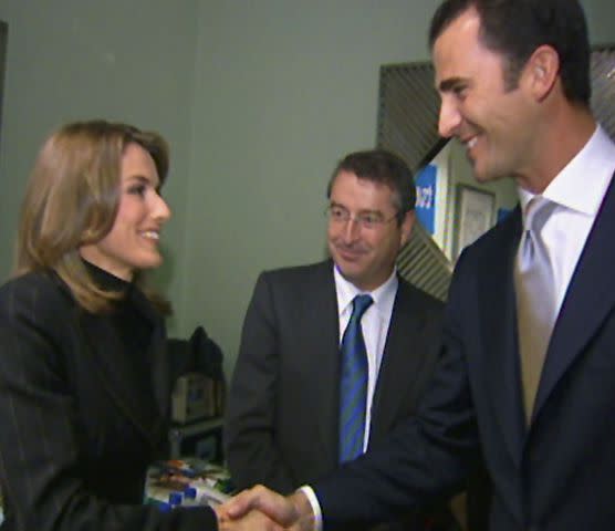 <p>Television Espanola/Getty</p> Letizia Ortiz Rocasolano shakes hands with Prince Felipe of Spain at the Prince of Asturias Awards in 2003.