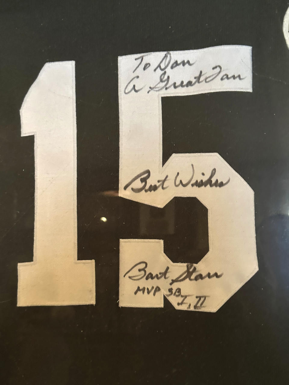 A jersey signed by Green Bay Packers quarterback Bart Starr is one of the many football souvenirs in super fan Don Crisman's collection, Thursday, Jan. 18, 2024, in Kennebunk, Maine. Crisman will travel to Las Vegas to attend his 58th NFL championship game. (AP Photo/David Sharp)