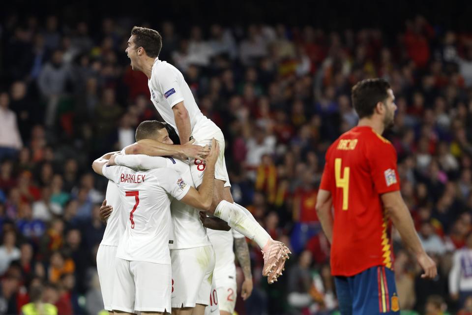 England's players celebrate the third goal of their team during the UEFA Nations League soccer match between Spain and England at Benito Villamarin stadium, in Seville, Spain, Monday, Oct. 15, 2018. (AP Photo/Miguel Morenatti)