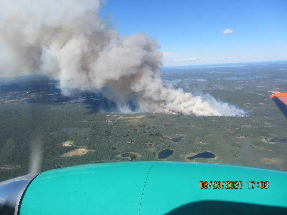 A wildfire burns near Behchoko, N.W.T., on June 30, 2020. Many communities will notice smoke from wildfires Friday.  (NWT Fire/Facebook - image credit)