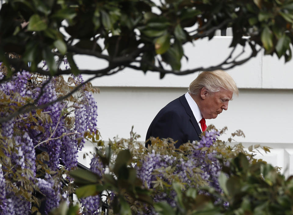 Donald Trump walking down stairs