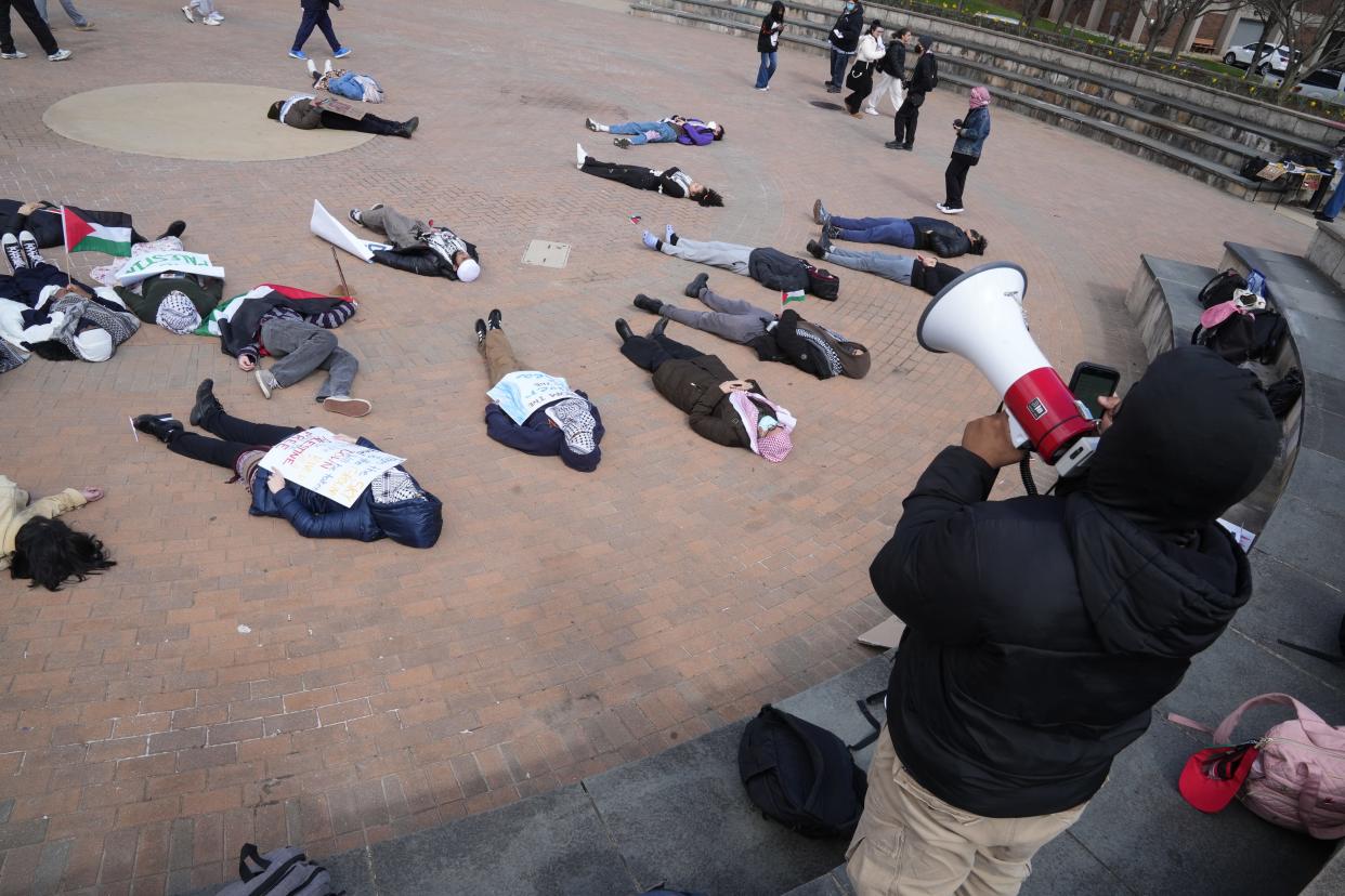 Piscataway, NJ March 19, 2024 -- The Endowment Justice Collective, a coalition of organizations at Rutgers University held a die in to call attention to the killings in Gaza. Students came and listened to some speeches and handed out information before the die in that took place in the courtyard at the Livingston campus student center. Names of Palestinian children killed in the war were read during the 20 minute die in.