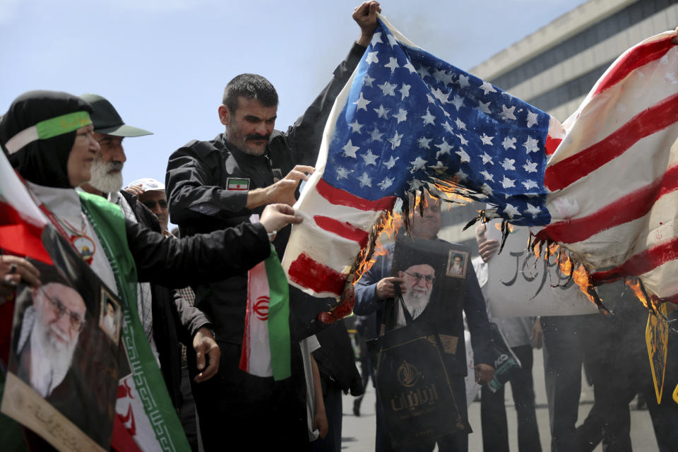 Iranian worshippers burn a representation of a U.S. flag during a rally after Friday prayer in Tehran, Iran, Friday, May 10, 2019. A top commander in Iran's powerful Revolutionary Guard said Friday that Tehran will not talk with the United States, an Iranian news agency reported — a day after President Donald Trump said he'd like Iranian leaders to "call me." (AP Photo/Ebrahim Noroozi)