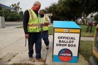 FILE PHOTO: FILE PHOTO: StreetsLA workers install one of 123 Vote by Mail Drop Boxes outside a public library, amid the global outbreak of the coronavirus disease (COVID-19), in Los Angeles