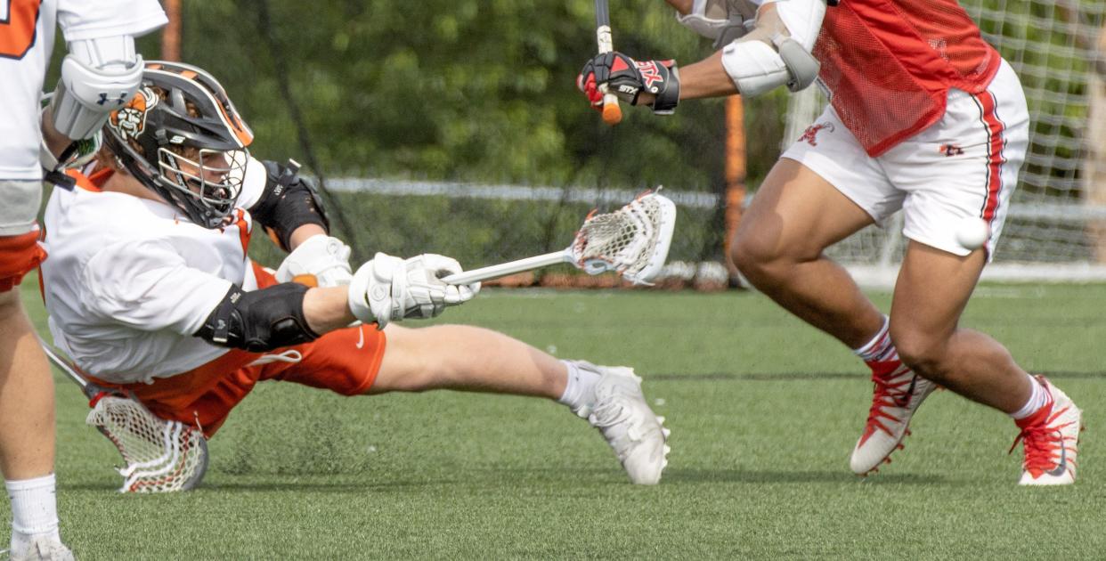 Hoover’s Drew Logan takes a shot against Shaker Heights, Saturday, May 22, 2021. (Bob Rossiter / Special to The Canton Repository)