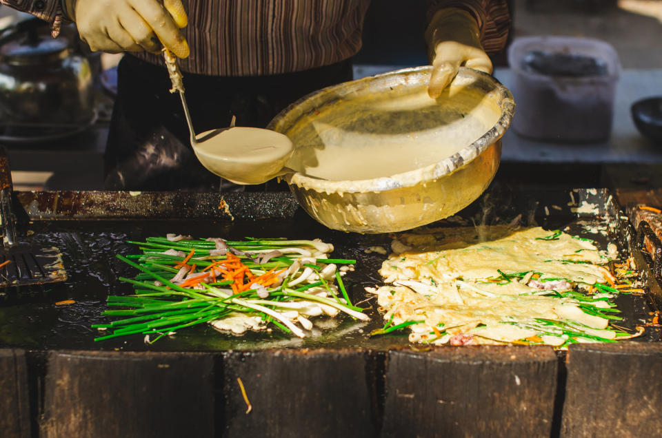 A street vendor making scallion pancakes.