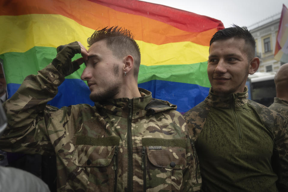 LGBT soldiers attend a Pride march in Kyiv, Ukraine, Sunday, June 16, 2024. Several hundred LGBT Ukrainian servicemen and other protesters joined the pride march in central Kyiv Sunday seeking legal reforms to allow people in same-sex partnerships to take medical decisions for wounded soldiers and bury victims of the war with Russia that extended across Ukraine more than two years ago. (AP Photo/Efrem Lukatsky)