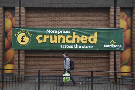 Shoppers walk past a branch of the food retailer Morrisons in west London, Britain, January 7, 2017. REUTERS/Toby Melville