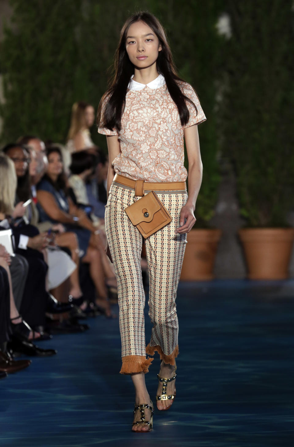 The Tory Burch Spring 2014 collection is modeled during Fashion Week in New York, Tuesday, Sept. 10, 2013. (AP Photo/Richard Drew)