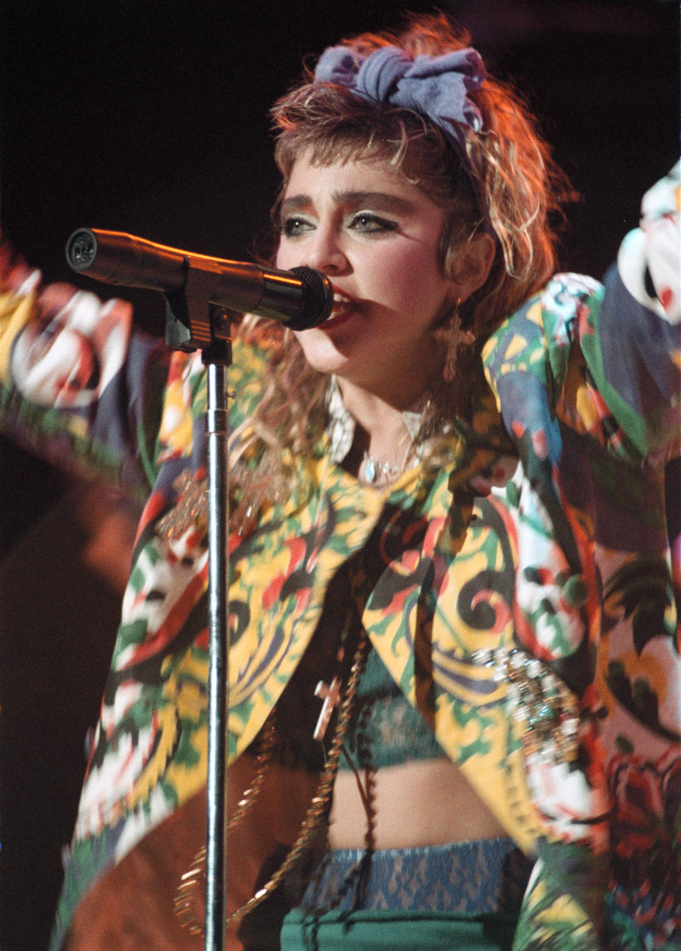 Pop singer Madonna performs onstage in 1985 in St. Paul, Minnesota in brightly coloured shirt.