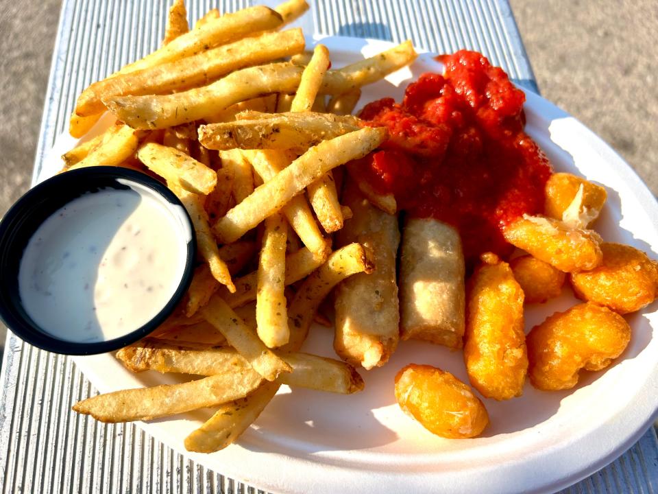 The iconic trio of sour cream and chive fries, mozzarella marinara and Leinie's beer-battered cheese curds is a festival staple throughout Milwaukee summers.