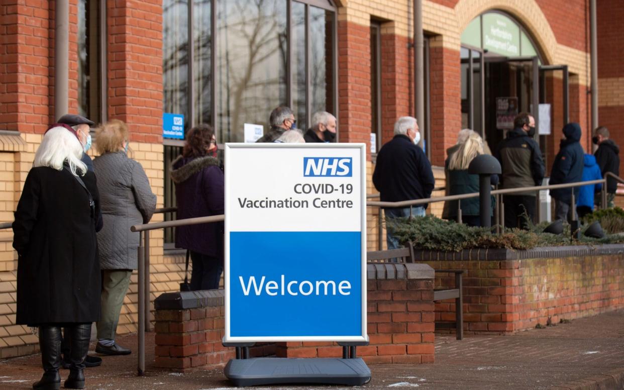 Queues for the Covid-19 vaccine at the mass vaccination hub at Robertson House in Stevenage, north of London - Joe Giddens/AFP