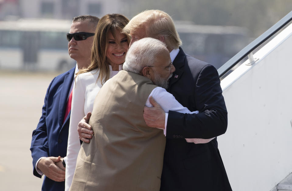 U.S. President Donald Trump is greeted by Indian Prime Minister Narendra Modi, with first lady Melania Trump, as they step off Air Force One upon arrival at Sardar Vallabhbhai Patel International Airport, Monday, Feb. 24, 2020, in Ahmedabad, India. (AP Photo/Alex Brandon)