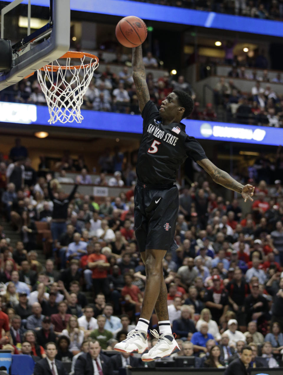 San Diego State forward Dwayne Polee II (5) dunks against Arizona during the first half in a regional semifinal NCAA college basketball tournament game, Thursday, March 27, 2014, in Anaheim, Calif. (AP Photo/Jae C. Hong)