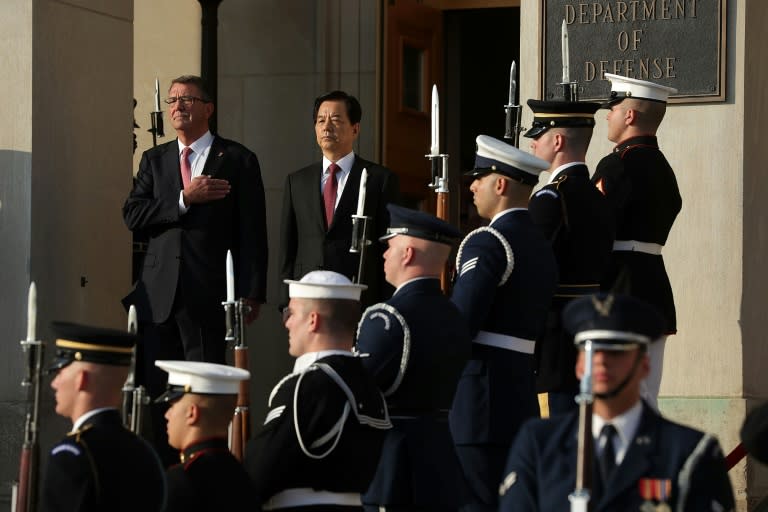 US Secretary of Defense Ashton Carter (L) welcomes South Korean National Defense Minister Han Min Koo on October 20, 2016 in Arlington, Virginia