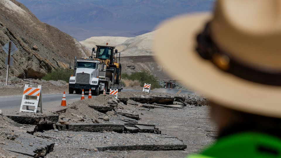 Road crews traverse along hwy 190 in Death Valley, California, on August 31, 2023, where most of the road was washed out.  - Robert Gauthier/Los Angeles Times/Getty Images