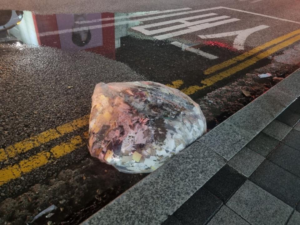 A plastic bag carrying various objects believed to have been sent by North Korea lies on a Seoul street (Reuters)