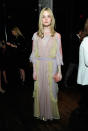 <p>Fanning looked fresh out of a fairytale in a lavender, light yellow and blush ruffled floor-length Valentino dress from the Spring 2015 collection. </p>