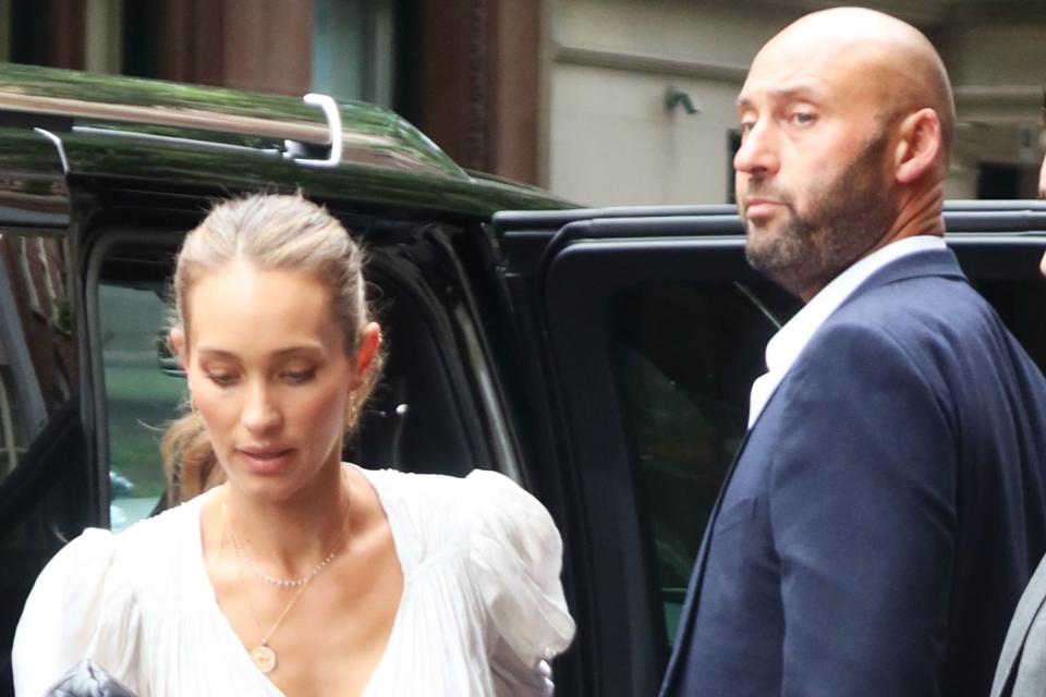 <p>Rick Davis / SplashNews.com</p> Derek and Hannah Jeter spotted in New York City.